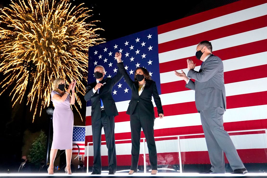 Former Vice President Joe Biden and with Democratic running mate Sen. Kamala Harris raise their arms up as fireworks go off in the background during the fourth day of the Democratic National Convention, Thursday, August 20, 2020.