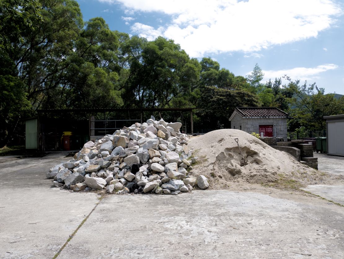 A pile of rocks and other materials wait to be used for path maintenance outside an AFCD office in the Ma On Shan Country Park.
