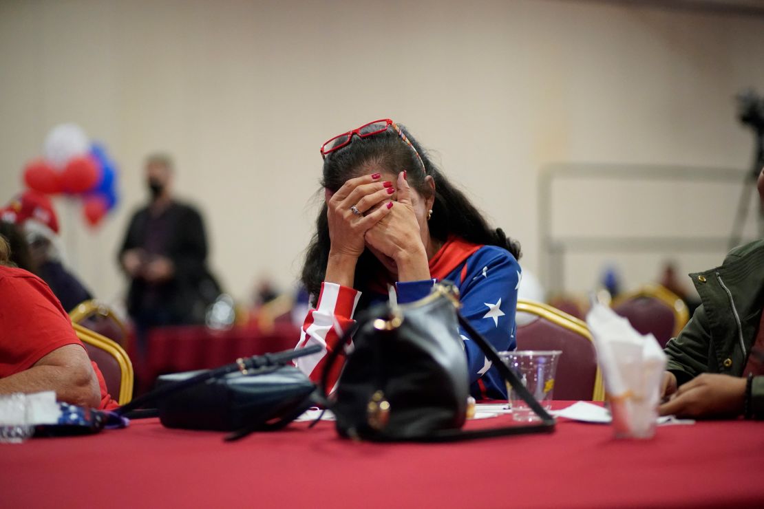 Trump supporter Loretta Oakes reacts while watching returns in favor of former Vice President Joe Biden at a Republican election-night watch party on Election Day in Las Vegas.