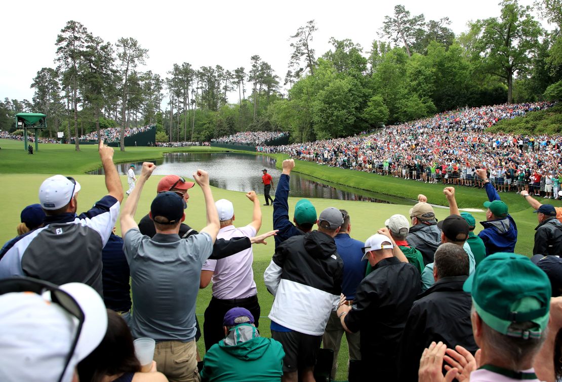 Patrons cheer as Tiger Woods celebrates his birdie on the 16th green during the final round of the Masters in 2019.