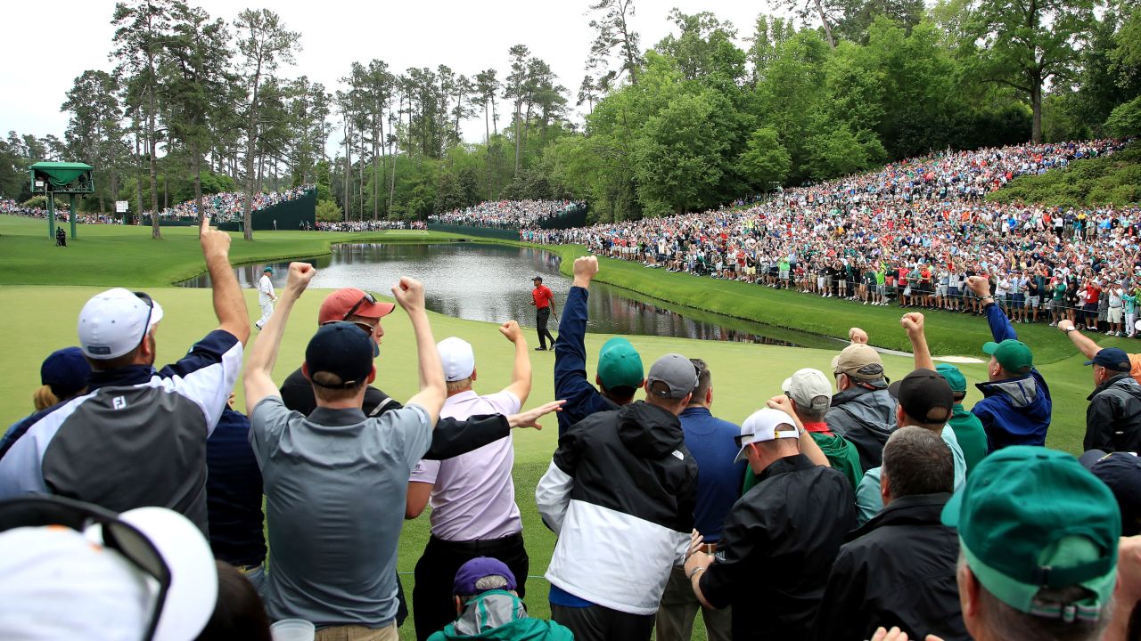 Patrons cheer as Tiger Woods celebrates his birdie on the 16th green during the final round of the Masters in 2019.
