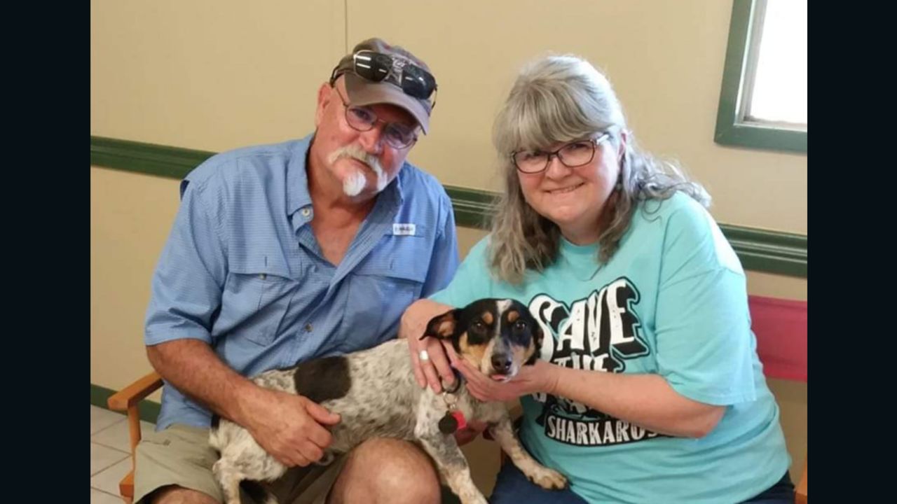 Chet and Betty Lou Switzer from Walnut Bend, Texas, hold their new dog, Lucka.