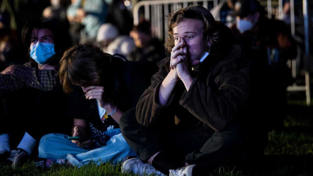 A person reacts as he watches election results in McPherson Square in Washington, DC, November 3. Finding meaning in this fraught moment and then acting to effect positive change can help you heal.