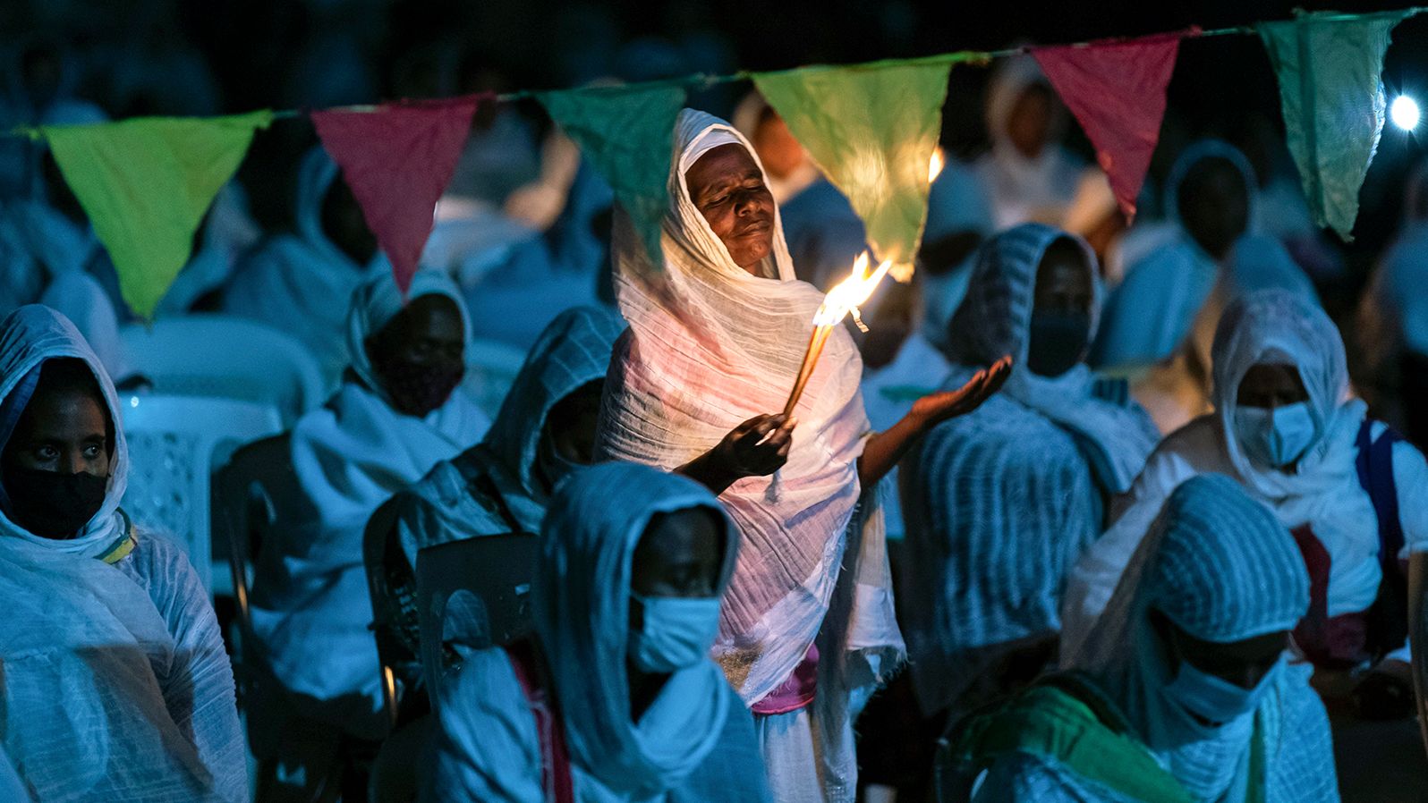 Ethiopian Orthodox Christians light candles and pray for peace during a church service at the Medhane Alem Cathedral in Addis Ababa, Ethiopia, on November 5.