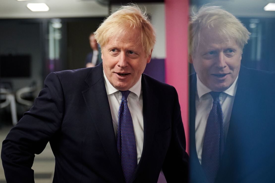 UK Prime Minister Boris Johnson visits the headquarters of Octopus Energy on October 5 in London