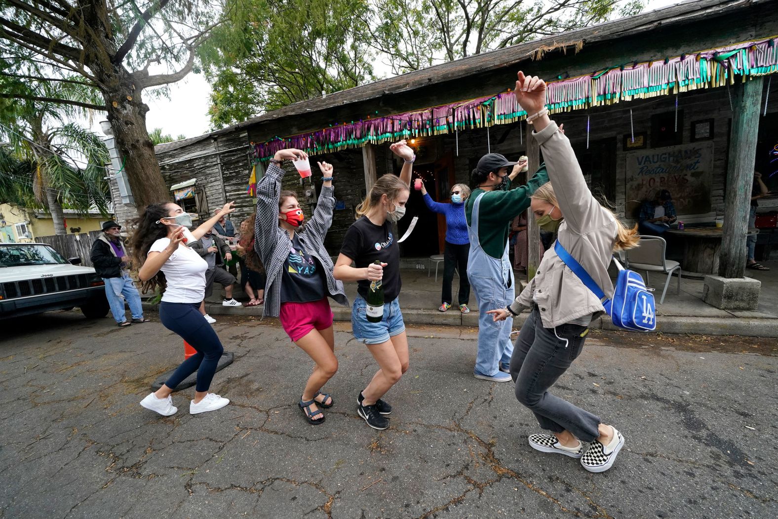 People celebrate outside Vaughn's Lounge in New Orleans.