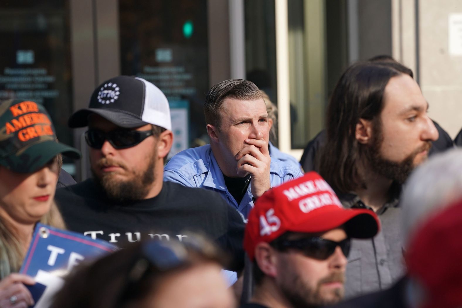 Trump supporters look on outside the Pennsylvania Convention Center.