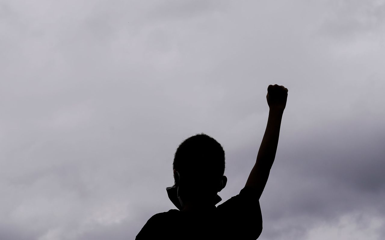 Christian Joseph, 9, raises his fist as he celebrates the election results in Atlanta.