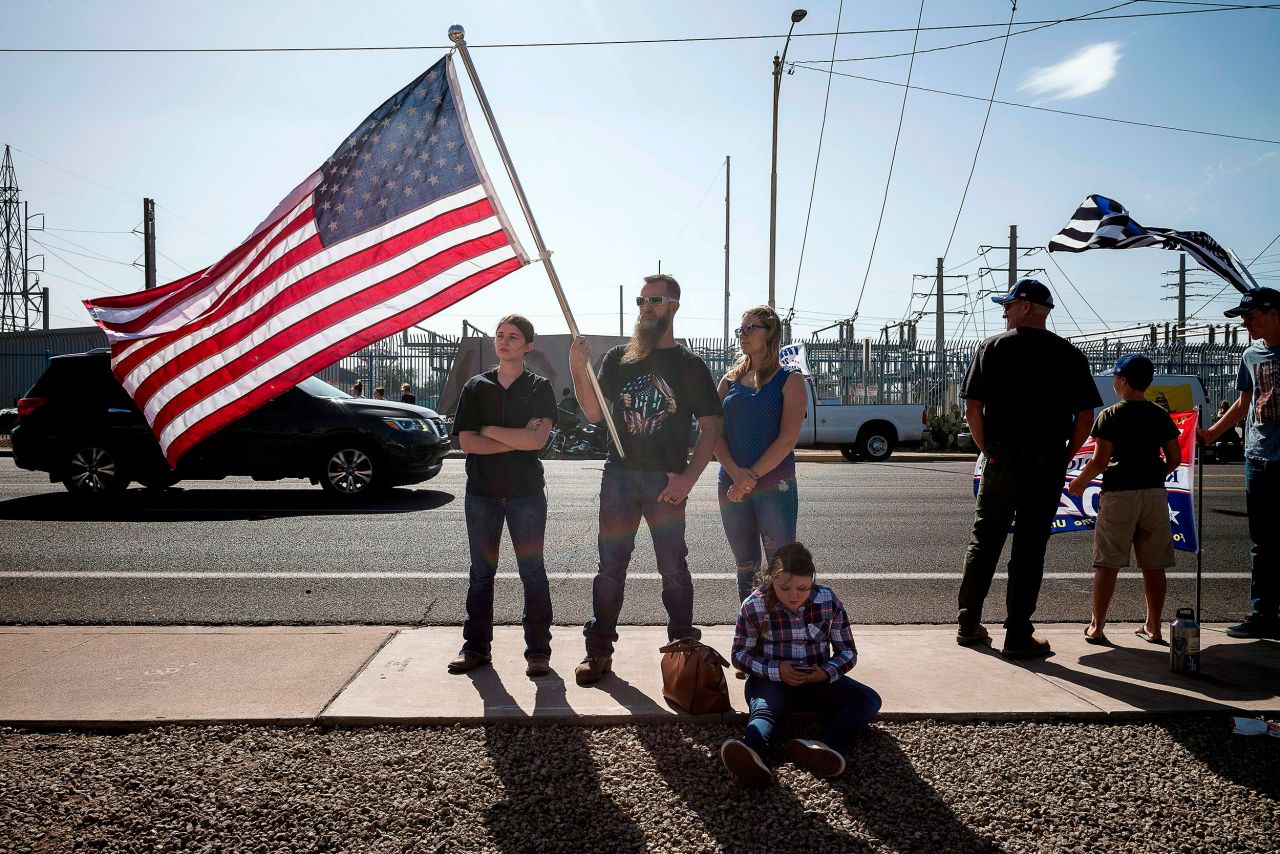 Trump supporters demonstrate in front of the Maricopa County Election Department in Phoenix.