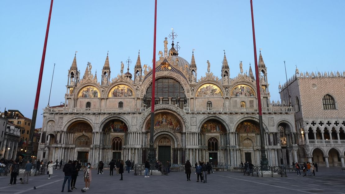 A few tourists visit St Mark's Square under Italy's semi-lockdown on November 7.