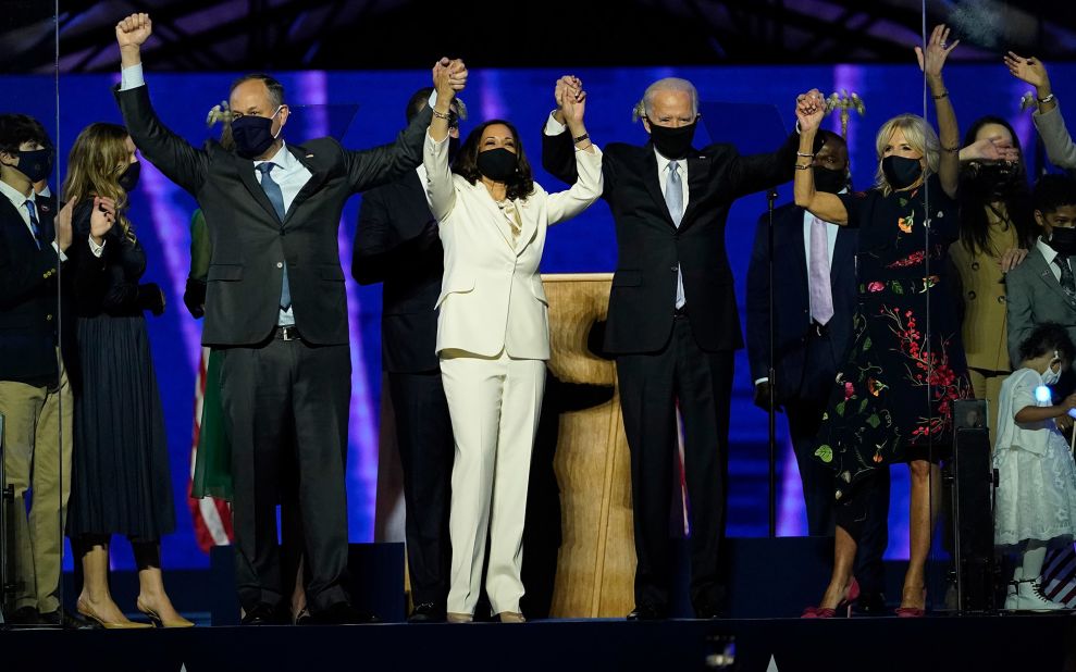 President-elect Joe Biden is joined by Vice President-elect Kamala Harris and their spouses at their victory speech in Wilmington, Delaware, on Saturday, November 7. The drive-in rally was held outside at the Chase Center.