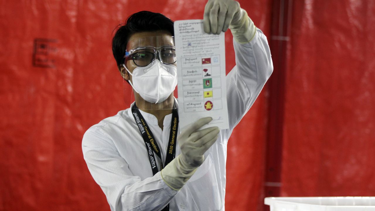 An official of the Union Election Commission counts ballots at a polling station on November 8 in Yangon, Myanmar.