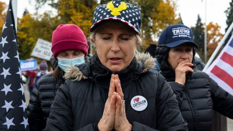 Supporters of President Donald Trump pray during a rally to protest against President-elect Joe Biden's win Saturday, Nov. 7, 2020 in Salem, Ore. 