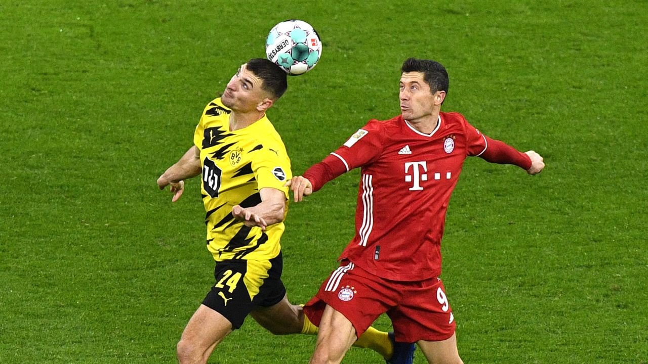 Dortmund's Thomas Meunier, left, and Bayern's Robert Lewandowski challenge for the ball during "Der Klassiker."