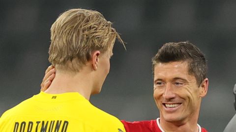 Erling Haaland of Dortmund and Robert Lewandowski Bayern Munich chat after the Bavarian club's 3-2 win at Signal Iduna Park.