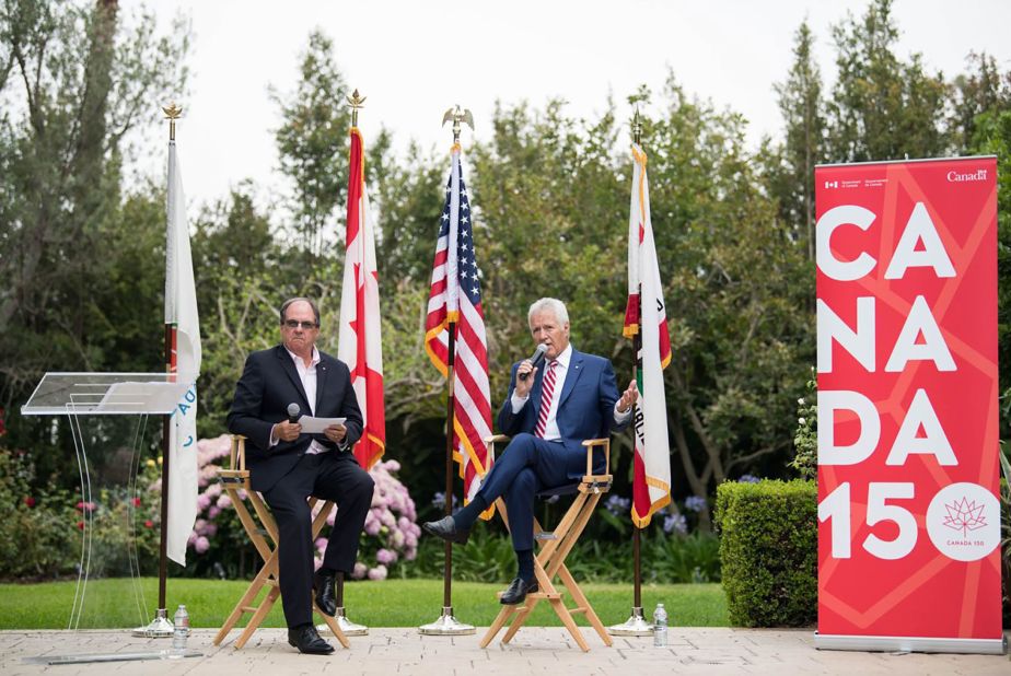 Consul General of Canada James Villeneuve and Trebek speak at the 150th anniversary of Canada's confederation at the consul general's official residence in Los Angeles on June 30, 2017. 