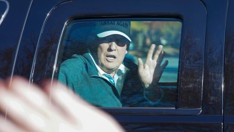 President Donald Trump waves to supporters as he departs after playing golf at the Trump National Golf Club in Sterling Va., Sunday Nov. 8, 2020. (AP Photo/Steve Helber)