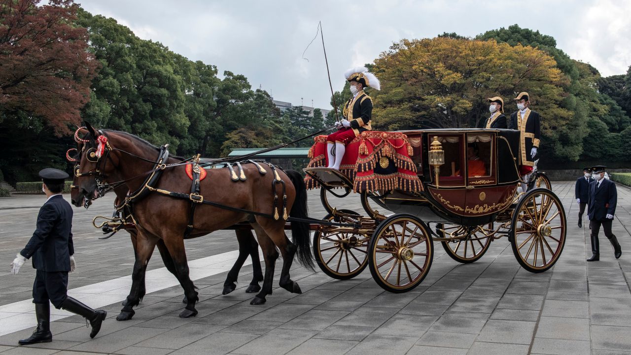 Crown Prince Akishino of Japan leaves the Imperial Palace in a horse drawn carriage in Tokyo on November 8.
