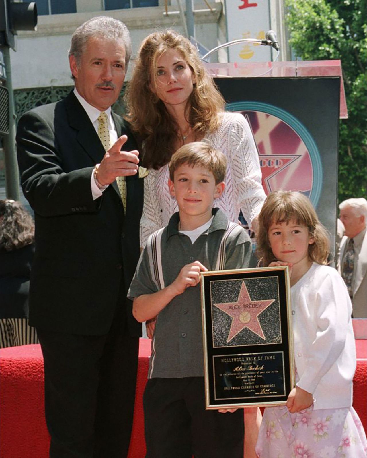 Trebek poses with his wife, Jean, and children Matthew and Emily after unveiling his star on the Hollywood Walk of Fame in May 1999.