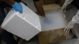 Health workers store blood samples in dry ice during clinical trials for a Covid-19 vaccine at Research Centers of America in Hollywood, Florida, U.S., on Wednesday, Sept. 9, 2020. Drugmakers racing to produce Covid-19 vaccines pledged to avoid shortcuts on science as they face pressure to rush a shot to market. Photographer: Eva Marie Uzcategui/Bloomberg via Getty Images