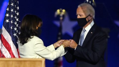 US President-elect Joe Biden and Vice President-elect Kamala Harris bump fists as they arrive to deliver remarks on November 7, 2020.