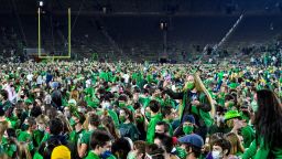 Nov 7, 2020; South Bend, Indiana, USA; Fans storm the field after the Notre Dame Fighting Irish defeated the Clemson Tigers 47-40 in two overtimes. Mandatory Credit: Matt Cashore-USA TODAY Sports