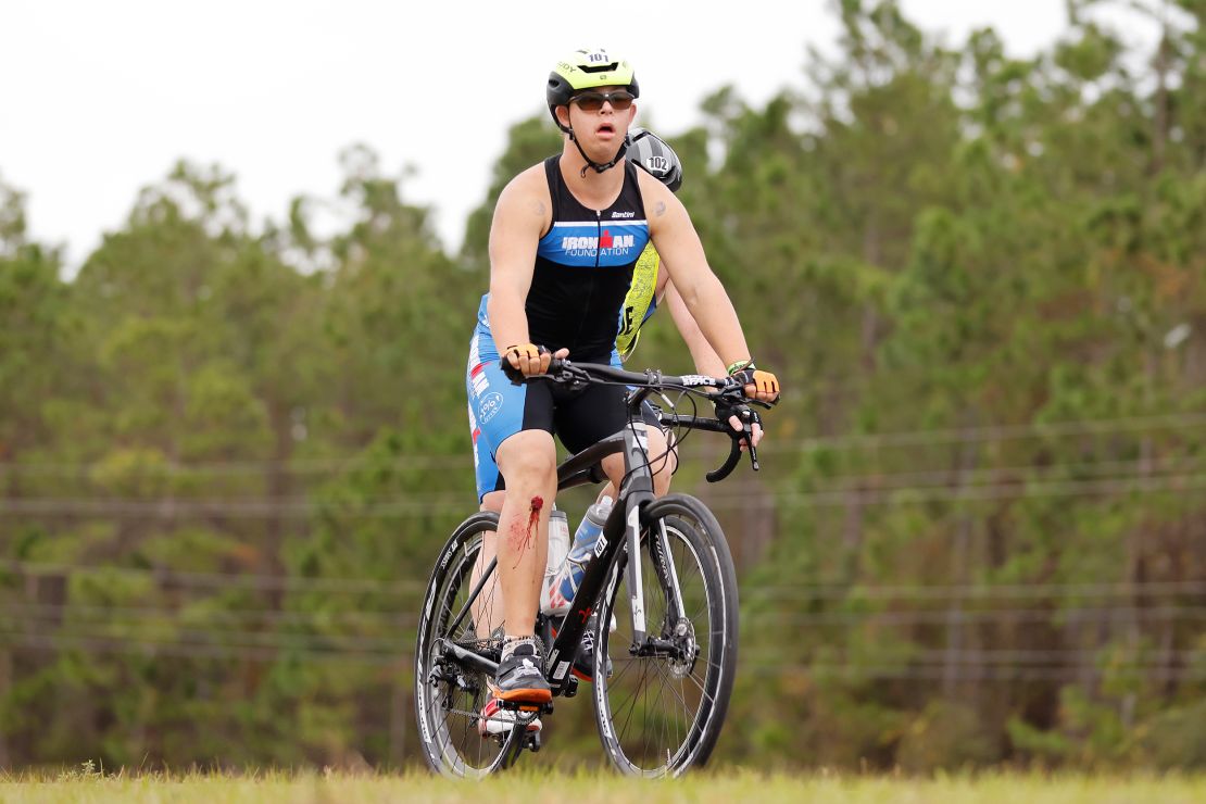 Chris Nikic competes in the bike portion with his guide, Dan Grieb, during Ironman Florida.