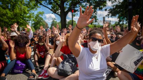Protesters raise their hands during a demonstration against racism and police brutality in Pittsburgh, Pennsylvania, on June 6, 2020