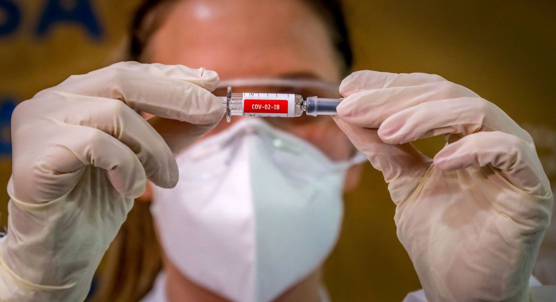 A nurse shows a Covid-19 vaccine produced by Sinovac Biotech at a hospital in Porto Alegre, Brazil on August 8, 2020.