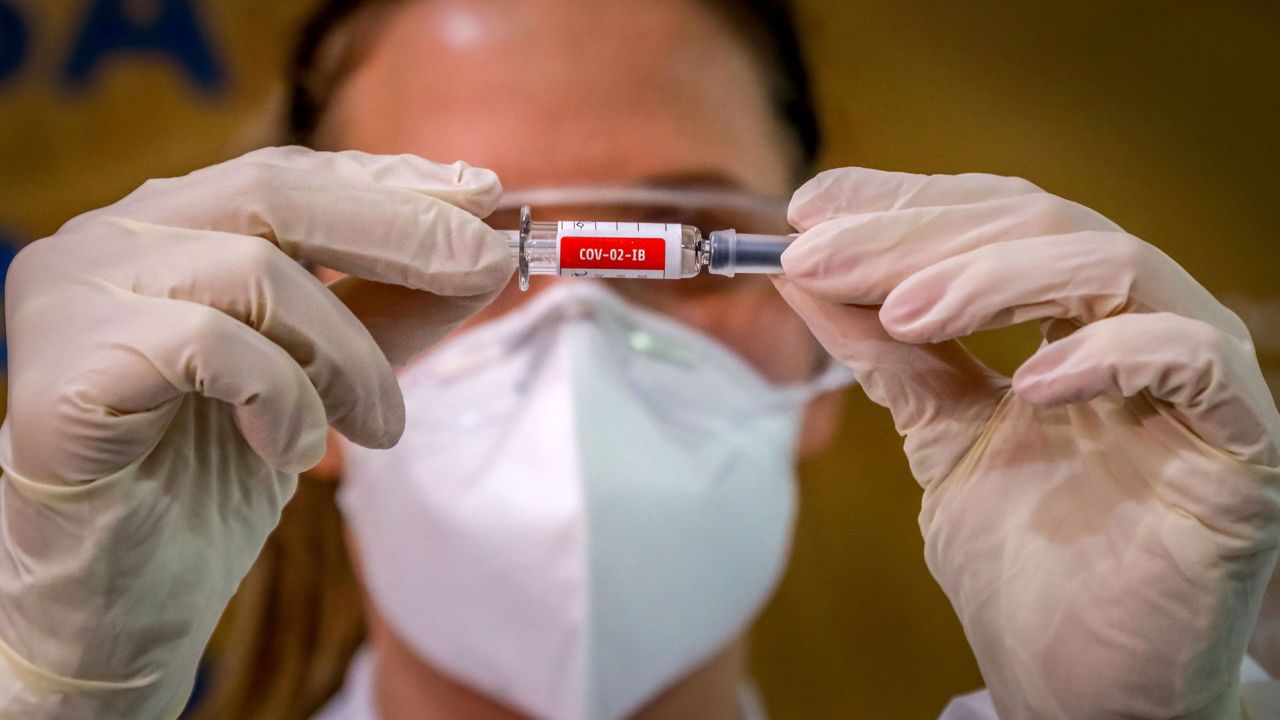 A nurse shows a Covid-19 vaccine produced by Sinovac Biotech at a hospital in Porto Alegre, Brazil on August 8, 2020.