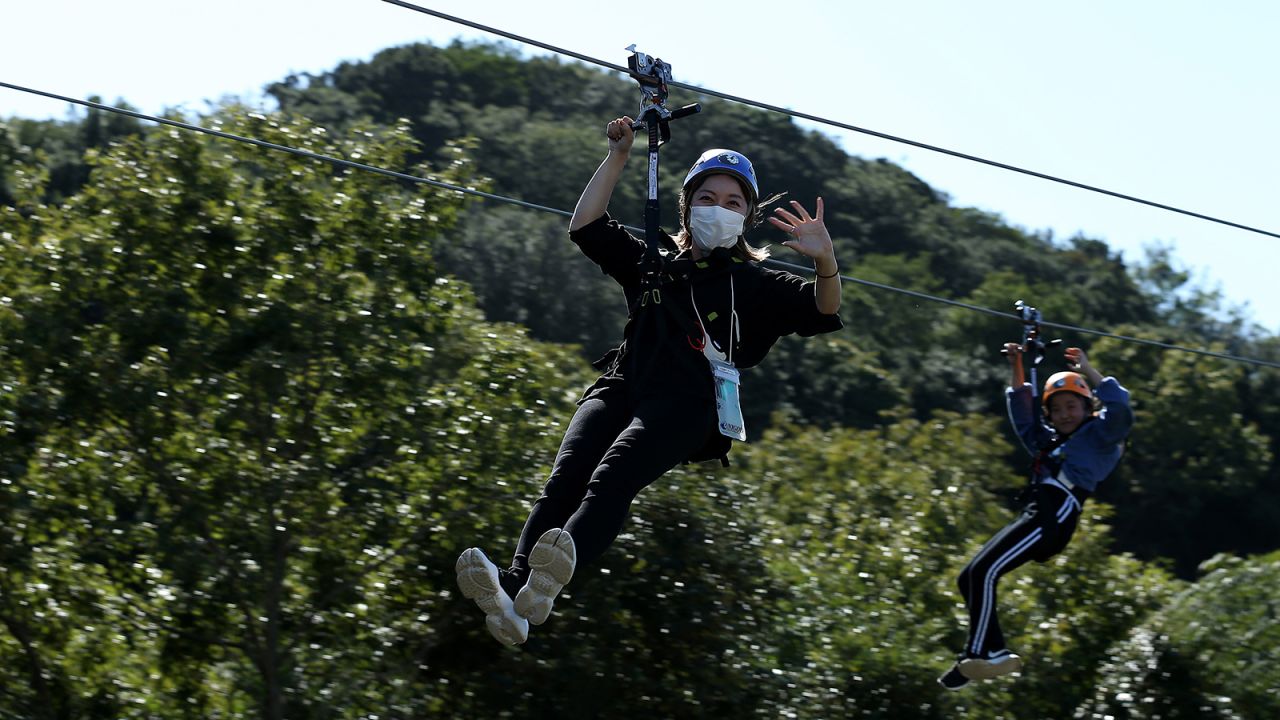 As part of the new Godzilla attraction, visitors can zipline into the beast's mouth.