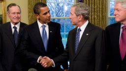U.S. President George W. Bush (2R) shakes hands with President-elect Barack Obama (2L), as former President Bill Clinton (R), and former President George H.W. Bush (L) look on in the Oval Office January 7, 2009 in Washington, DC. On January 20, 2009 Barack Obama will be sworn in as the nation's 44th president.  (Photo by Ron Sachs-Pool/Getty Images)