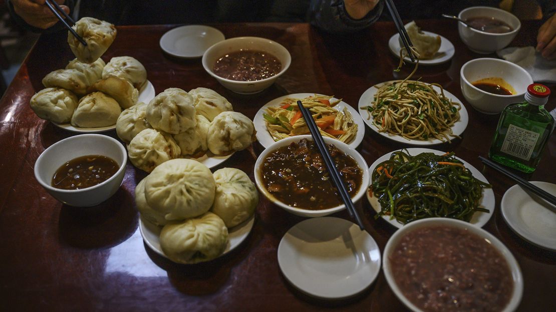 Biden sampled a variety of popular local eats during his 2011 visit, including steamed buns and fried noodles. 