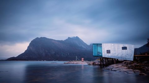 Perched on the edge of the Arctic Circle, on the remote island of Manhausen in northern Norway, a series of cabins, built by Snorre Stinessen Arkitektur, are specially designed to withstand extreme weather conditions. Each one is propped up by stilts and positioned according to wave height and projected sea level rise.