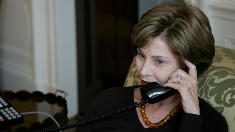 In this White House photo, first lady Laura Bush talks to Michelle Obama by telelphone at the White House November 5, 2008.