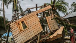 Men fix a small house in "El Muelle" Neighbourhood in Bilwi, Nicaragua on November 5, 2020, after the passage of hurricane Eta. 