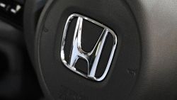 A Honda logo is pictured from a displayed car at a Honda showroom of companys headquarters in Tokyo on November 6, 2020. (Photo by Philip FONG / AFP) (Photo by PHILIP FONG/AFP via Getty Images)