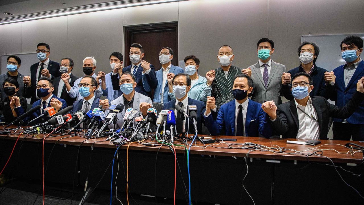 Pro-democracy lawmakers join hands at the start of a press conference in a Legislative Council office in Hong Kong on Wednesday.