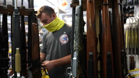 A customer looks at long guns at Coliseum Gun Traders Ltd. in Uniondale, New York on September 25, 2020.