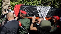 11 November 2020, Palestinian Territories, Jericho: Palestinian honour guard carry the coffin of late chief negotiator and secretary general of the Palestine Liberation Organisation, Saeb Erekat, during his funeral in the West Bank city of Jericho. Erekat has died on Tuesday at the age of 65 following complications related to Covid-19. Photo: Ilia Yefimovich/dpa (Photo by Ilia Yefimovich/picture alliance via Getty Images)