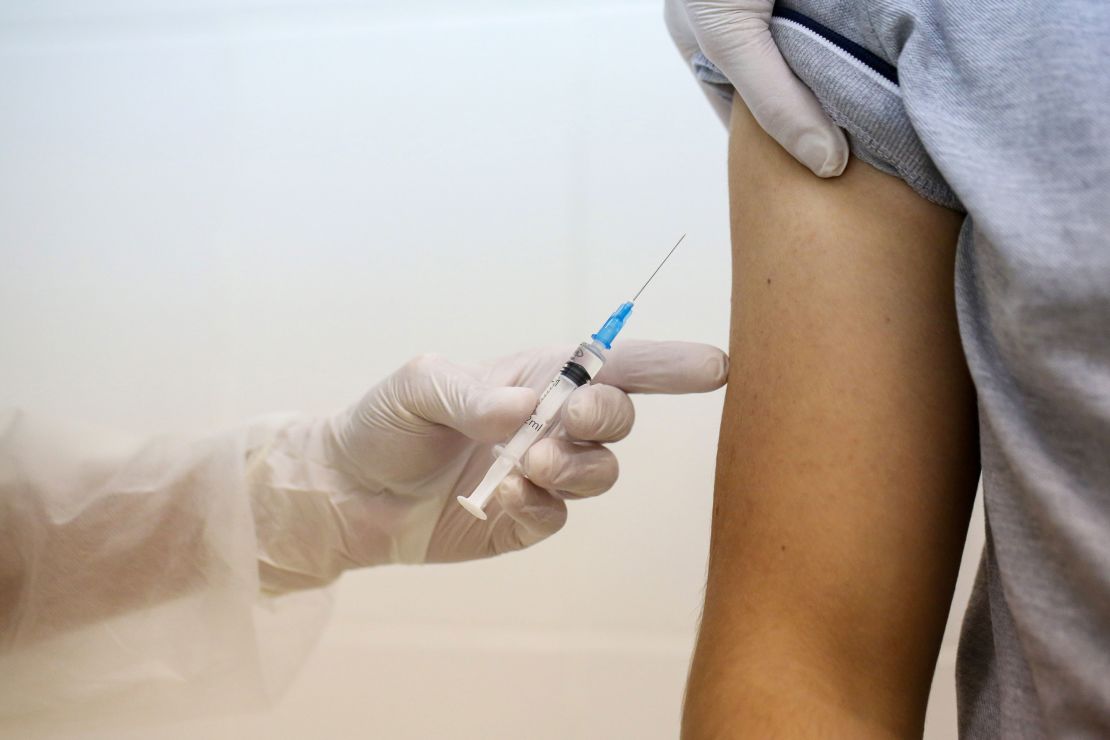 A heath worker prepares to inject the Sputnik V vaccine into a patient's arm during a trial at the City Clinic #46 in Moscow, Russia, on September 23.