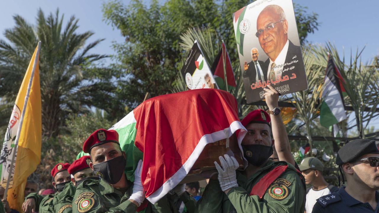 A Palestinian honor guard carries the body of Saeb Erekat into the cemetery in Jericho.