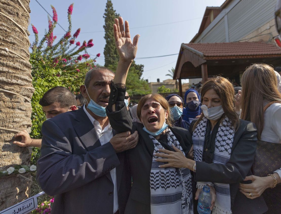 Neameh Erekat, center, weeps during the funeral of her husband Saeb Erekat in Jericho.