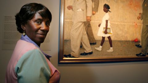  Lucille Bridges poses next to the 1964 Norman Rockwell painting, "The Problem We All Live With," that depicts her daughter, Ruby, desegregating her school accompanied by federal agents. 