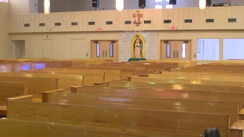 The pews of Our Lady of the Light Church are largely empty during the recording of mass for Univision, allowing parishioners to watch from home. 