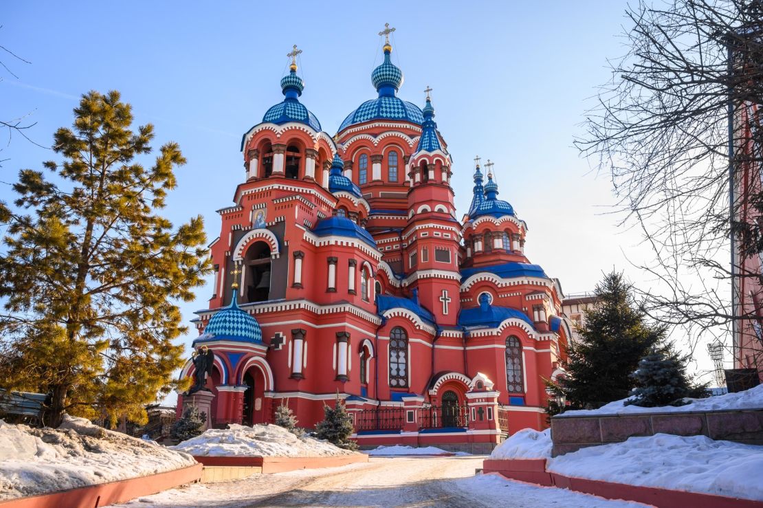 Our Lady of Kazan Church in Irkutsk, Russia, is bright red, like Saint Basil's, and stands out with vivid blue domes.