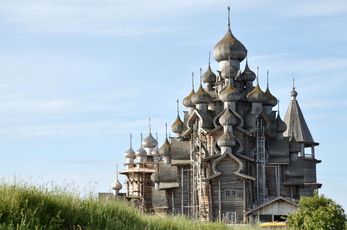 The Church of the Transfiguration in Kizhi, Russia, is a wooden cathedral topped with many onion domes.
