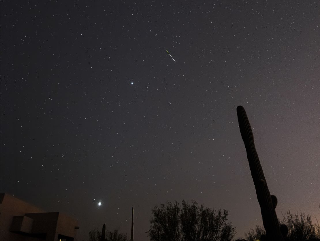 A leonid meteor shoots across the sky in Tucson, Arizona, with Jupiter and Venus visible as well. 