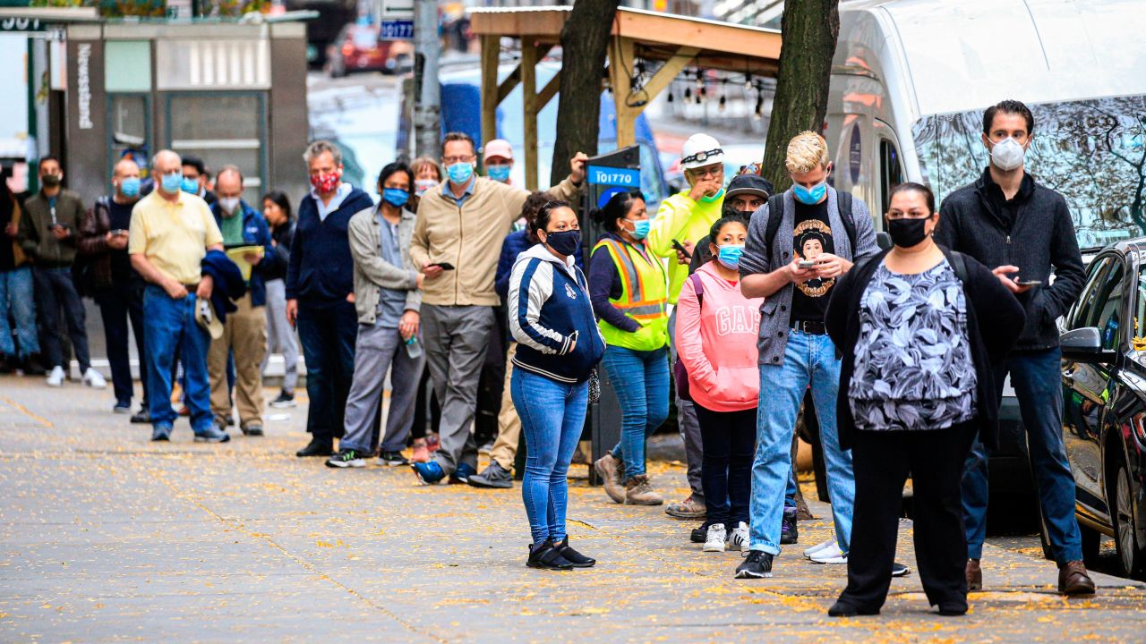 People line up outside a Covid-19 testing site in New York on November 11, 2020. - The novel coronavirus has killed at least 1,275,113 people since the outbreak emerged in China last December, according to a tally from official sources compiled by AFP at 1100 GMT on Wednesday. At least 51,531,660 cases of coronavirus have been registered. Of these, at least 33,300,900 are now considered recovered. (Photo by Kena Betancur / AFP) (Photo by KENA BETANCUR/AFP via Getty Images)