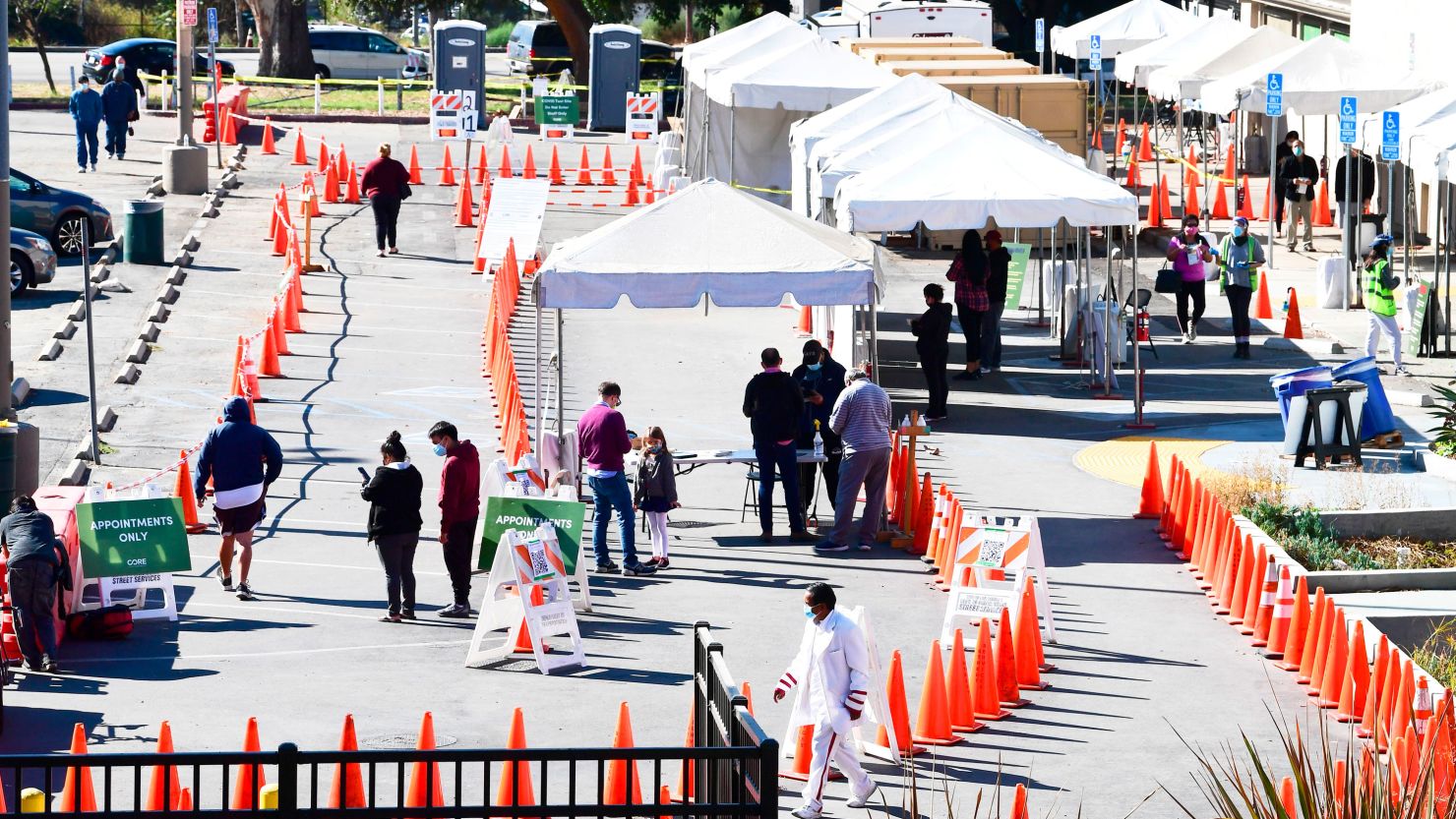 People line up for coronavirus tests at a site in Los Angeles on Tuesday.